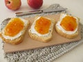 Twice-baked bread with cream cheese and peach jam