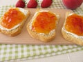 Twice-baked bread with peach-strawberry-jam Royalty Free Stock Photo