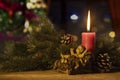 Baby Jesus statue with a burning candle Royalty Free Stock Photo