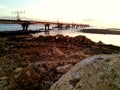 twilight atmosphere when the sea water recedes with a long bridge