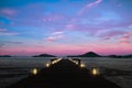 twilight background beautiful pier decorated with lanterns in silent sea Royalty Free Stock Photo