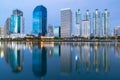 Twilight city office building reflection over water lake Royalty Free Stock Photo