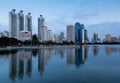 Twilight city office building with water reflection Royalty Free Stock Photo