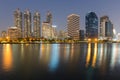 Twilight city office building with water reflection Royalty Free Stock Photo