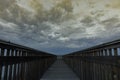 Twilight clouds forming over the boardwalk at Palo Alto Baylands Royalty Free Stock Photo