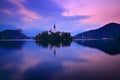 Twilight evening light in, Bled, Slovenia. lake island, St Martin Catholic church and Castle with mountain Range, Slovenia, Europ