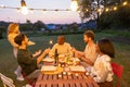 Twilight Garden Party with Friends and Sparklers Royalty Free Stock Photo
