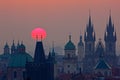 Twilight in historical city. Magical picture of tower with orange sun in Prague, Czech Republic, Europe. Beautiful detailed sunris