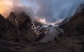 Majestic glacier is illuminated by the bright golden evening sun. Panoramic view. Altai Mountains