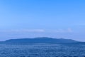 Twilight seascape from Opatija riviera in Croatia. Silhouette of Cres island. Royalty Free Stock Photo