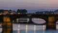 Twilight sky scene of Ponte Santa Trinita Holy Trinity Bridge day to night timelapse over River Arno Royalty Free Stock Photo