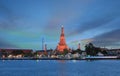 Twilight time of Wat Arun across Chao Phraya River during sunset in Bangkok, Thailand