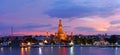 Twilight time of Wat Arun across ChaoPhraya River Royalty Free Stock Photo