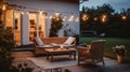 Twilight Tranquility, Summer Evenings on the Terrace of a Beautiful Suburban House, Adorned with Wicker Furniture and Delicate Royalty Free Stock Photo