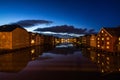 Twilight view of colorful wooden buildings on stilts along the Nidelva River, Trondheim, Norway Royalty Free Stock Photo