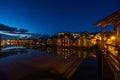 Twilight view of colorful wooden buildings on stilts along the Nidelva River, Trondheim, Norway Royalty Free Stock Photo