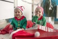 Twin babies elf helper of Santa Royalty Free Stock Photo