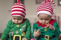 Twin babies elf helper of Santa Royalty Free Stock Photo