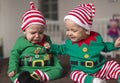 Twin babies elf helper of Santa