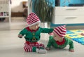 Twin babies elf helper of Santa Royalty Free Stock Photo