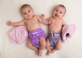 Twin babies girls with ecologic cloth diapers Royalty Free Stock Photo