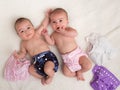 Twin babies girls with ecologic cloth diapers Royalty Free Stock Photo