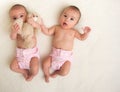 Twin babies girls with ecologic cloth diapers Royalty Free Stock Photo