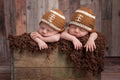 Twin Baby Boys Wearing Football Shaped Hats Royalty Free Stock Photo