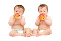 Twin baby girls are eating Royalty Free Stock Photo