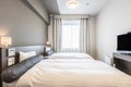 Twin bed and blanket in a small bedroom Royalty Free Stock Photo