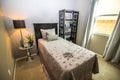 Twin Bedroom With Nightstand And Bookcase