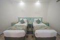 Twin beds in a luxury suite of a hotel room Royalty Free Stock Photo