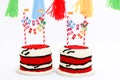 Twin birthday cakes with banners