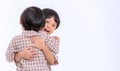 Twin boys hugging on white background. Portrait of little son hugging brother or friend. I missing you. Full length happy boy emb