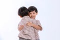 Twin boys hugging  on white background. Portrait of little son hugging brother or friend. I missing you. Full length happy boy emb Royalty Free Stock Photo