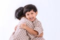 Twin boys hugging  on white background. Portrait of little son hugging brother or friend. I missing you. Full length happy boy emb Royalty Free Stock Photo