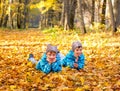 Twin boys in the park. Autumn.