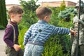 Twin brothers explore statue of the knight