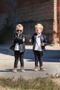 Twin brothers in leather jackets and sunglasses.Two identical blond boys Royalty Free Stock Photo