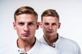 twin brothers men in white casual clothes look alike, brother