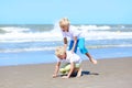 Twin brothers playing on the beach Royalty Free Stock Photo