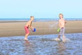 Twin brothers running on the beach Royalty Free Stock Photo