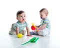 Twin brothers with shovel and rake Royalty Free Stock Photo