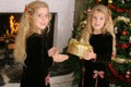 Twin children opening presents
