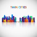 Twin cities skyline silhouette in colorful geometric style.