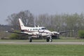 Twin-engine business airplane during landing Royalty Free Stock Photo