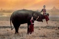 Twin girls In the Kuay tribe costume Playing with elephants in the morning in Surin, Thailand Royalty Free Stock Photo