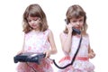 Twin girls with phone Royalty Free Stock Photo