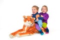 Twin Girls riding a Tiger Royalty Free Stock Photo