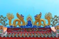 Twin golden chinese dragon on top roof for exterior decoration on blue sky, holy place chinese temple Royalty Free Stock Photo